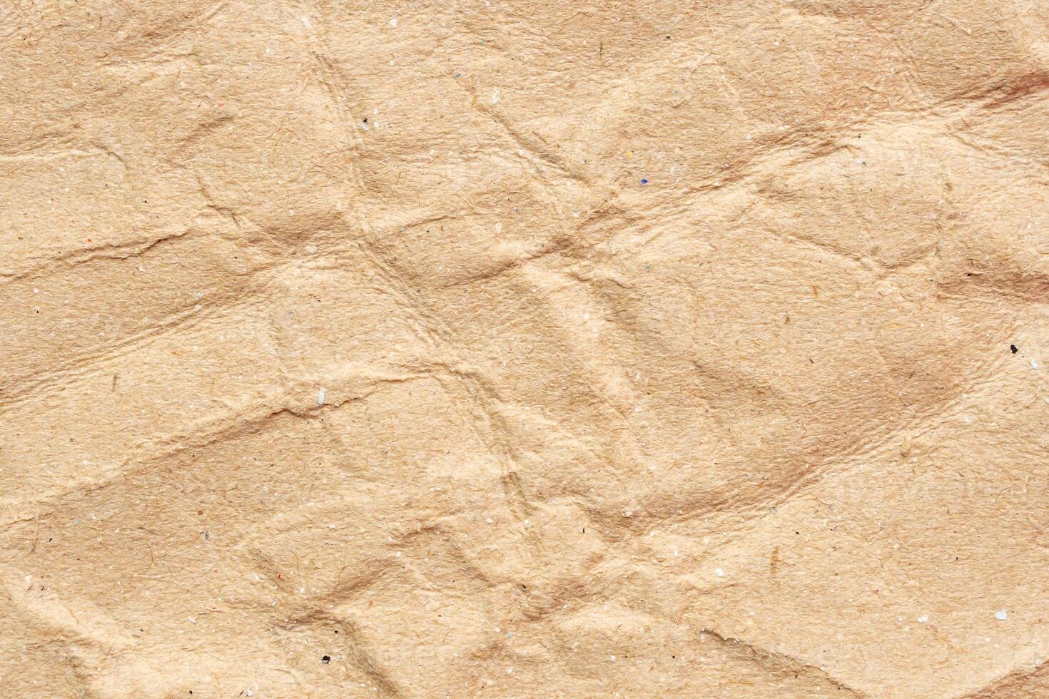 Abstract crumpled and creased recycle brown paper texture background photo