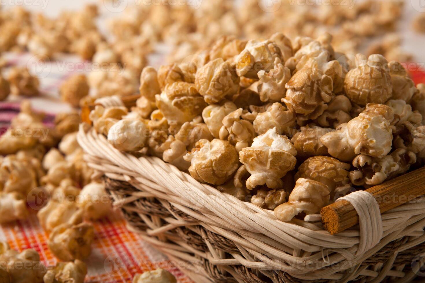 caramel popcorn in a basket on a napkin photo