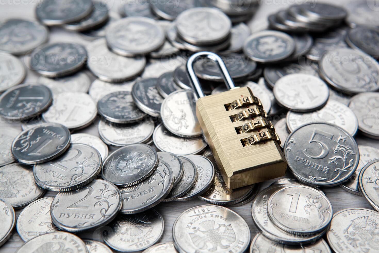 brass padlock with code and russian ruble coins photo
