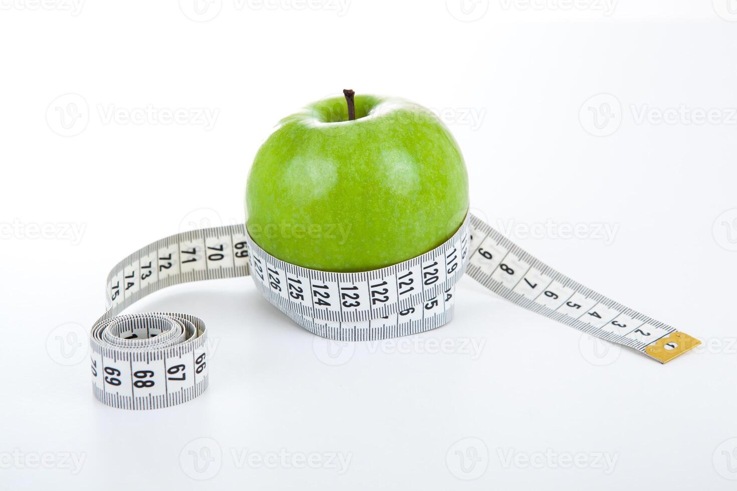 green apple with a ruler photo