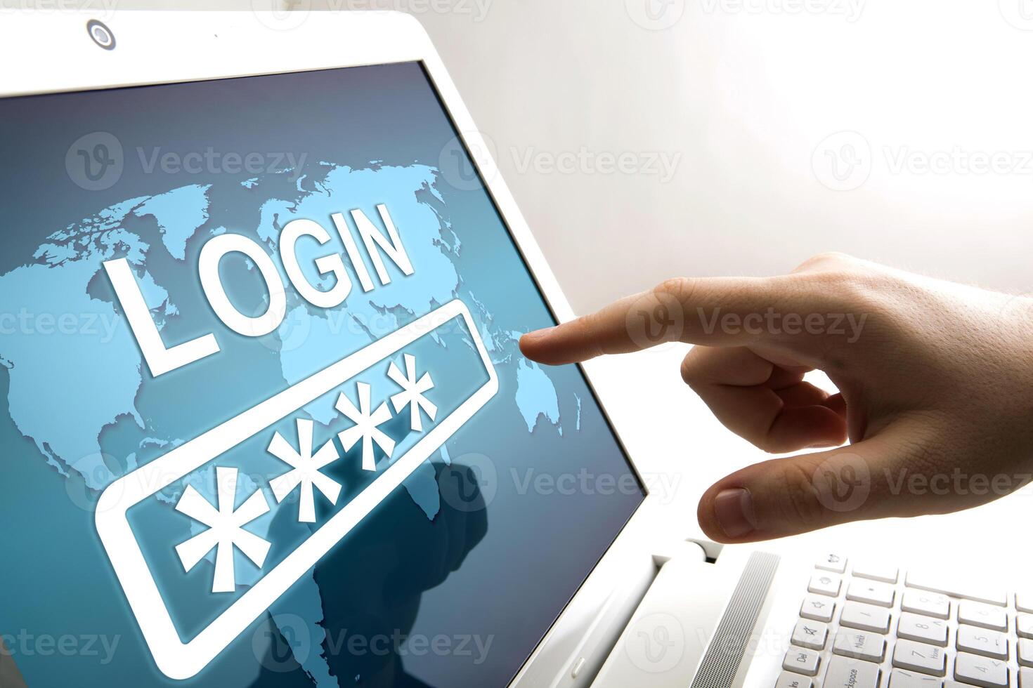 human fingers on the notebook screen with login and network authorization photo