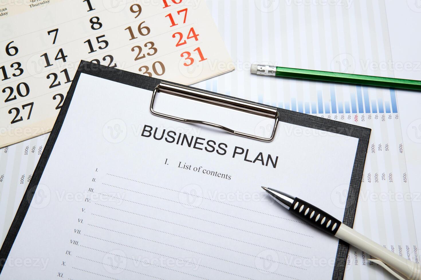 Business still life with business plan photo