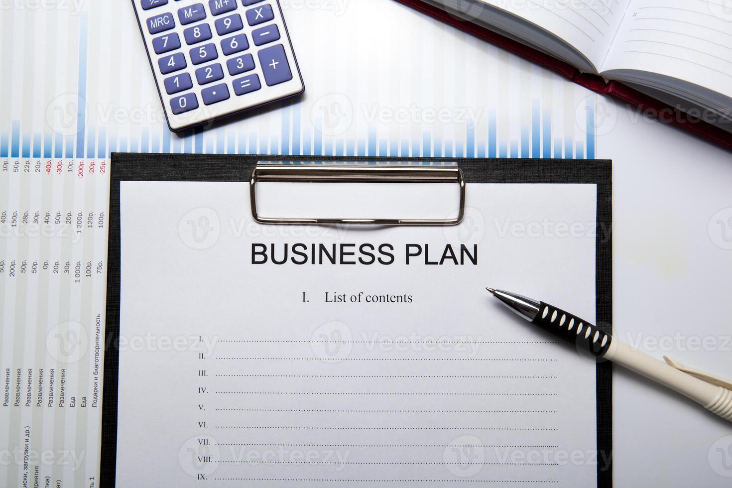 Business still life with business plan photo