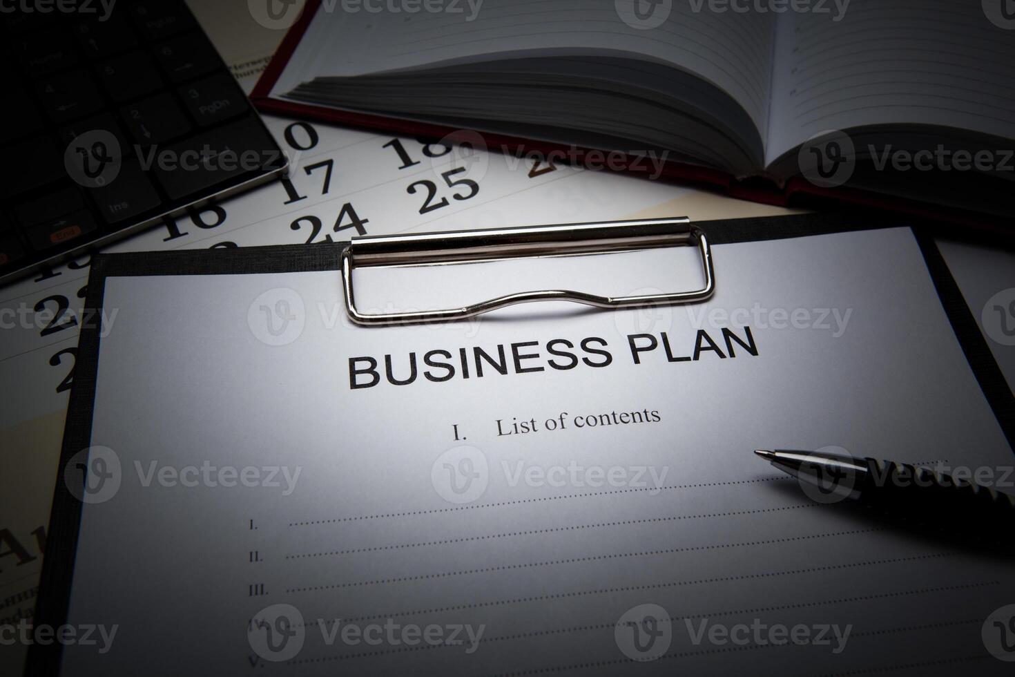 Business still life with business plan photo