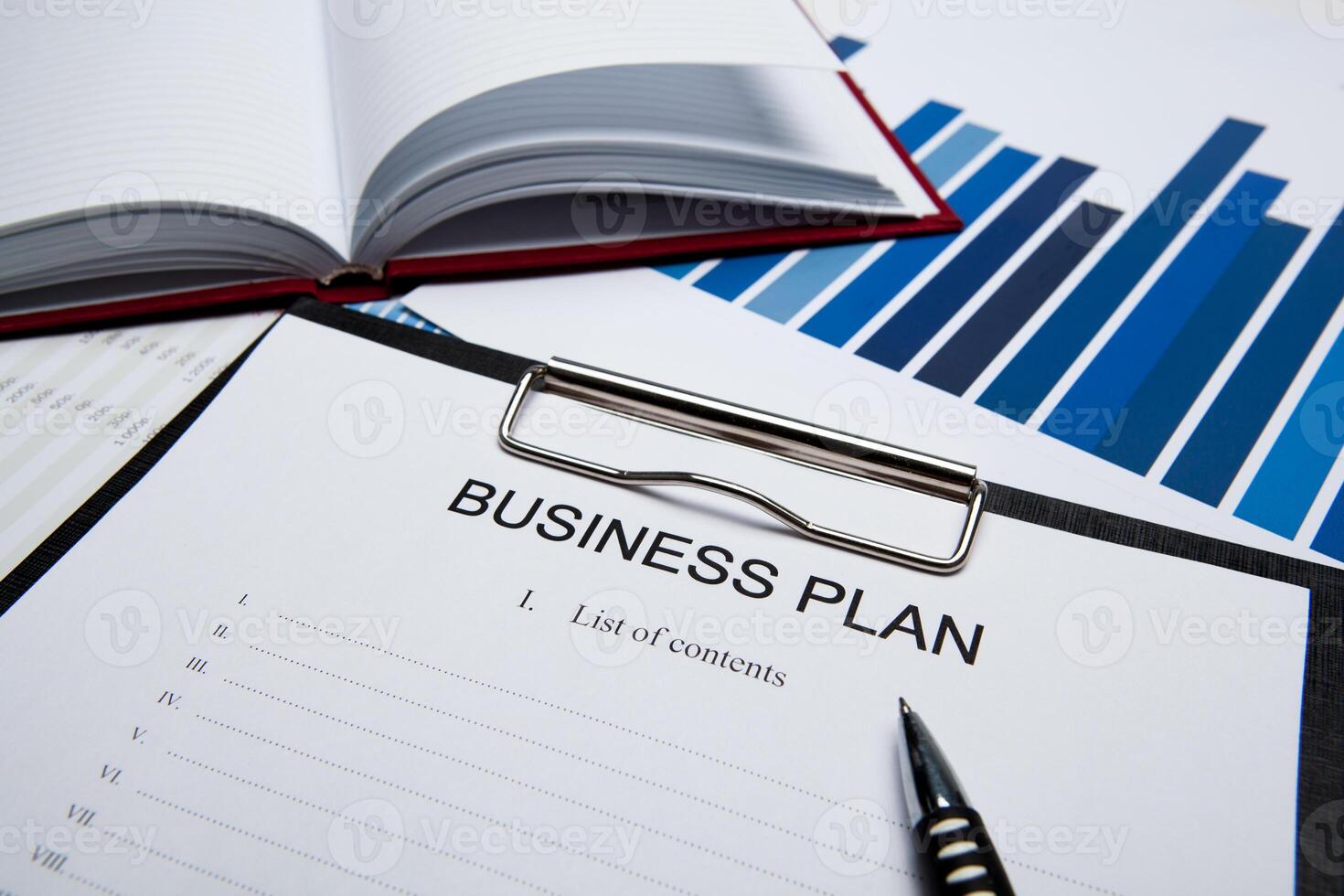 Business still life with business plan photo