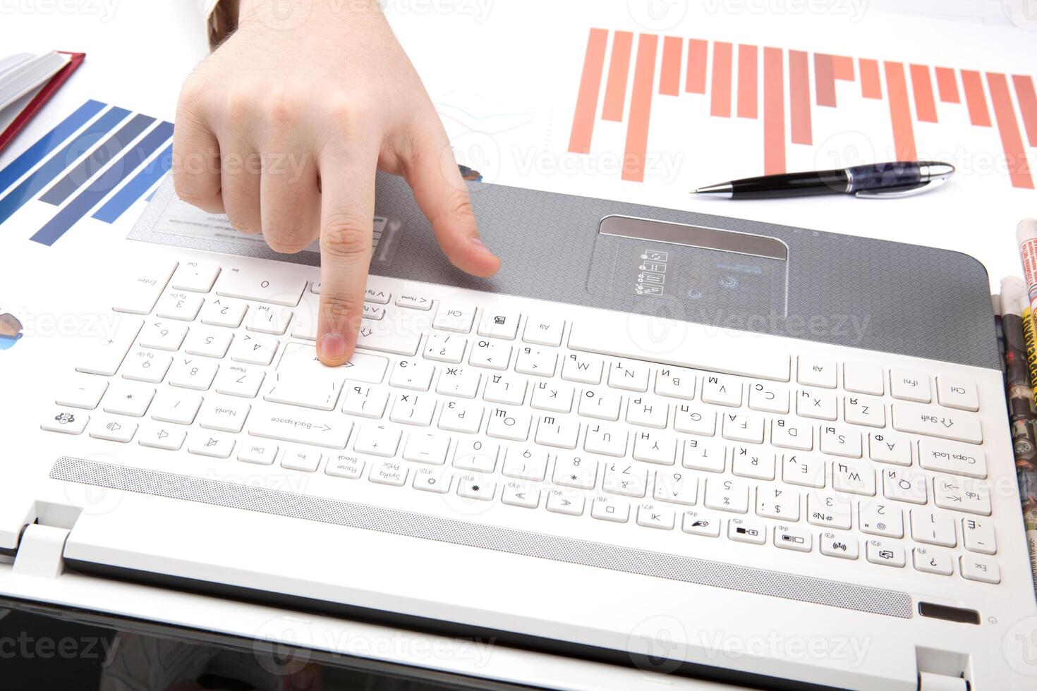 human hands on the notebook keyboard photo