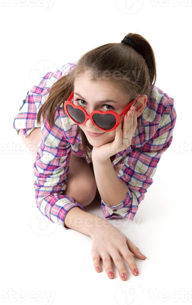 young girl in shorts and a t-shirt on a white background photo