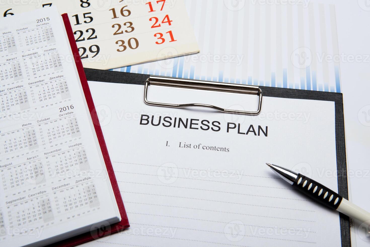 Business still life with business plan photo