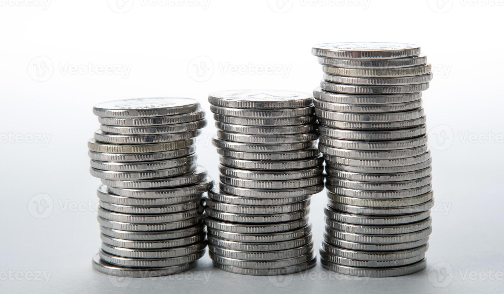 stacks of coins on a white background photo