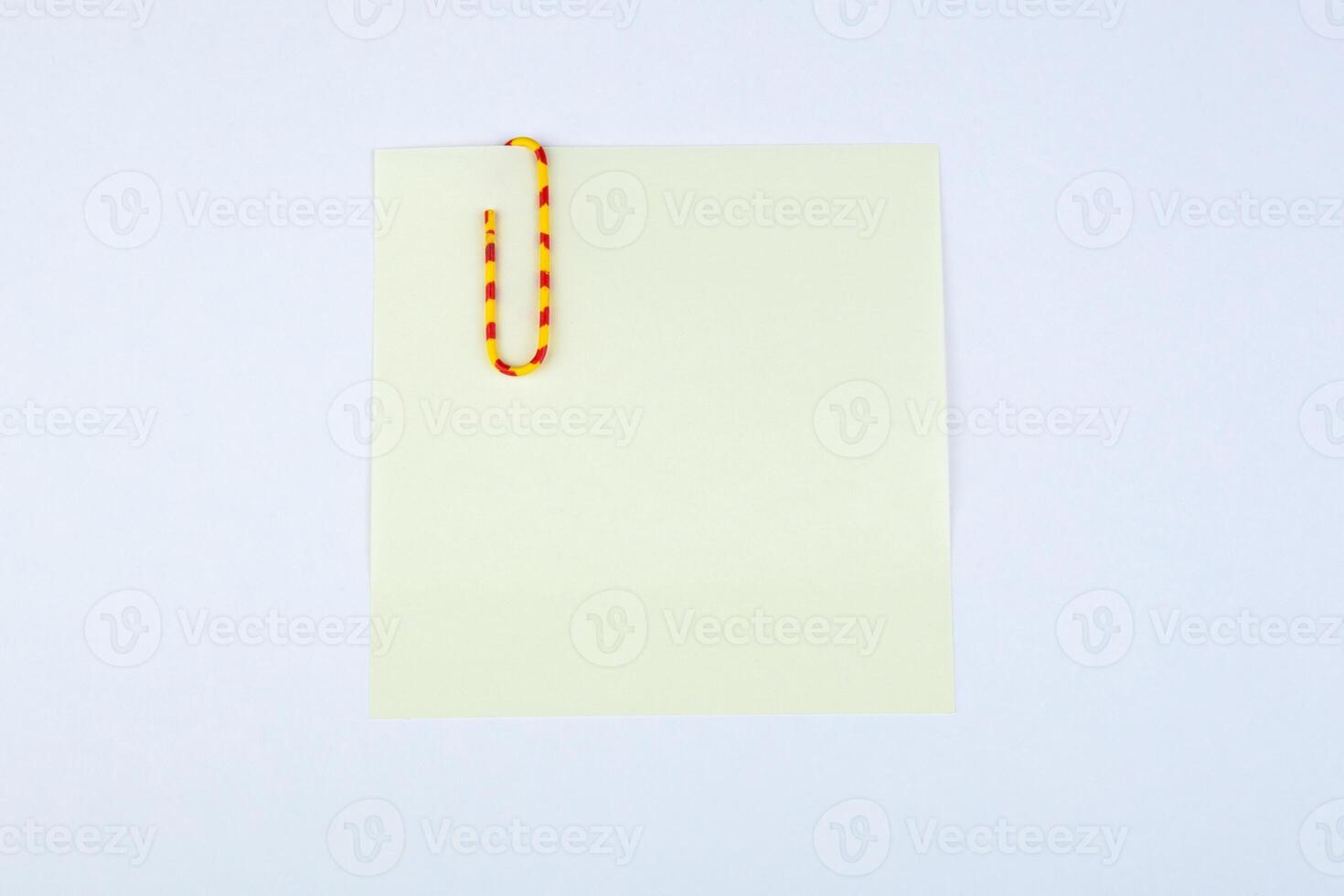sheet of paper witn paper clip photo