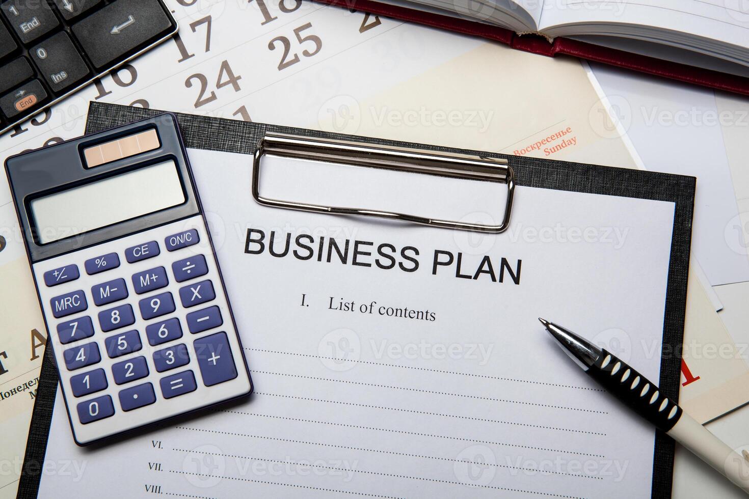 Business still life with business plan photo