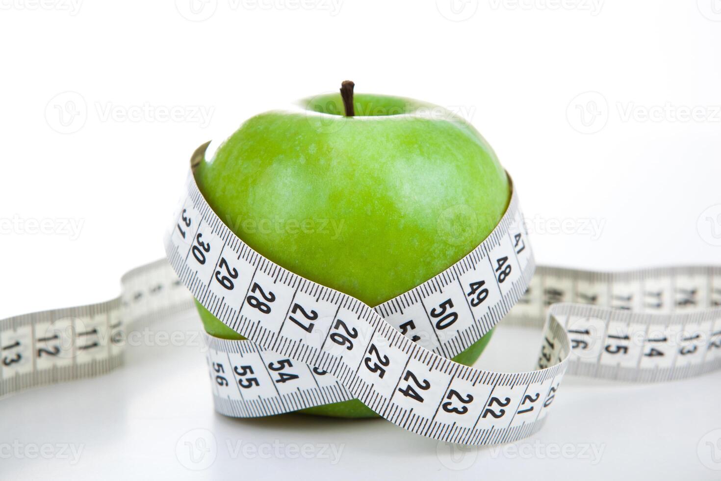 green apple with a ruler photo