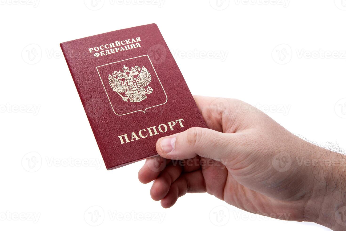 Russian passport in the hand of a man on a white background as identification photo