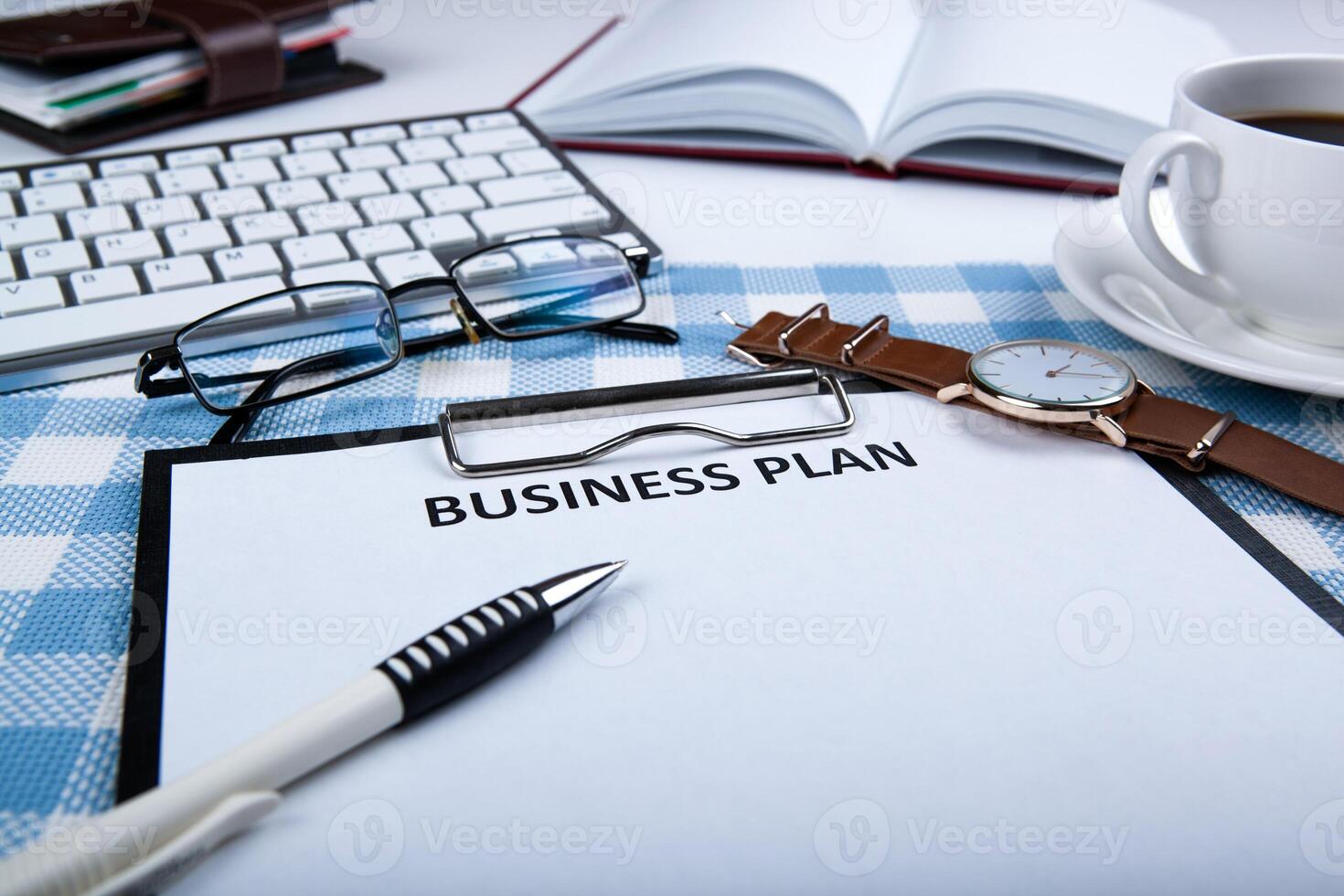 Business still life with business plan photo