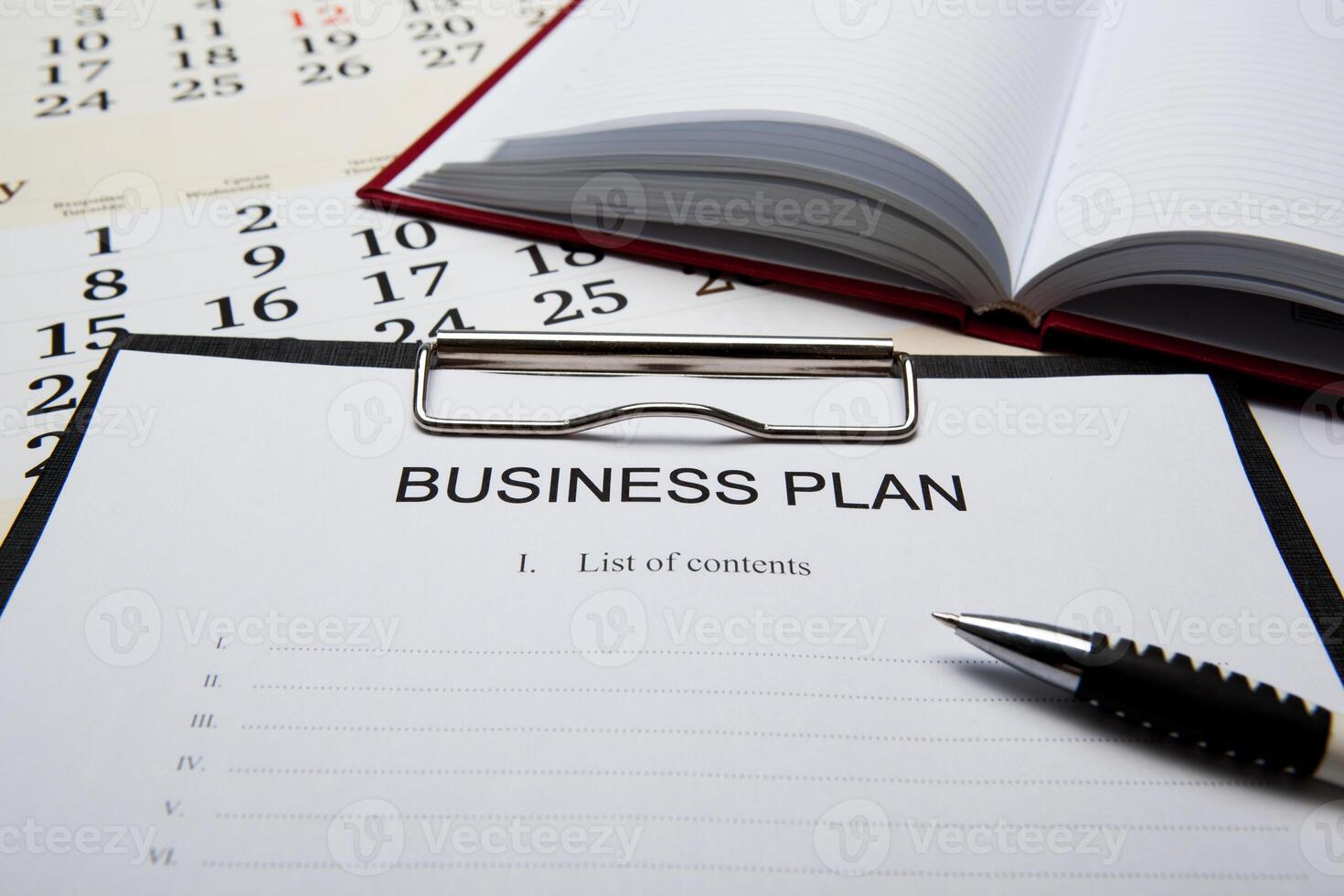 Business still life with business plan photo