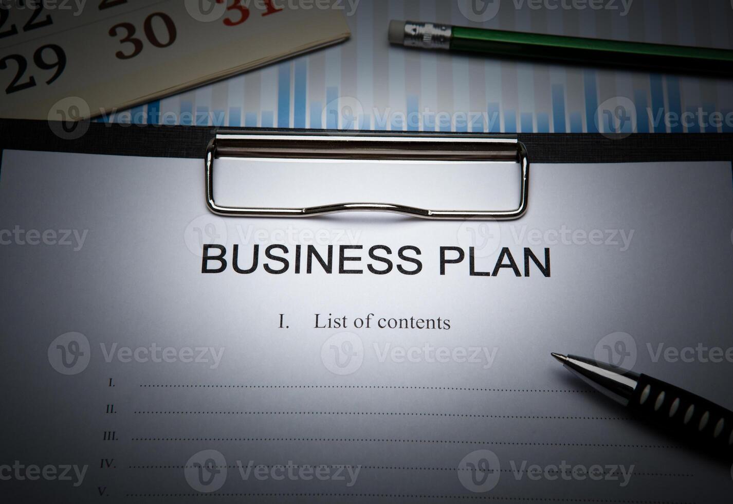 Business still life with business plan photo