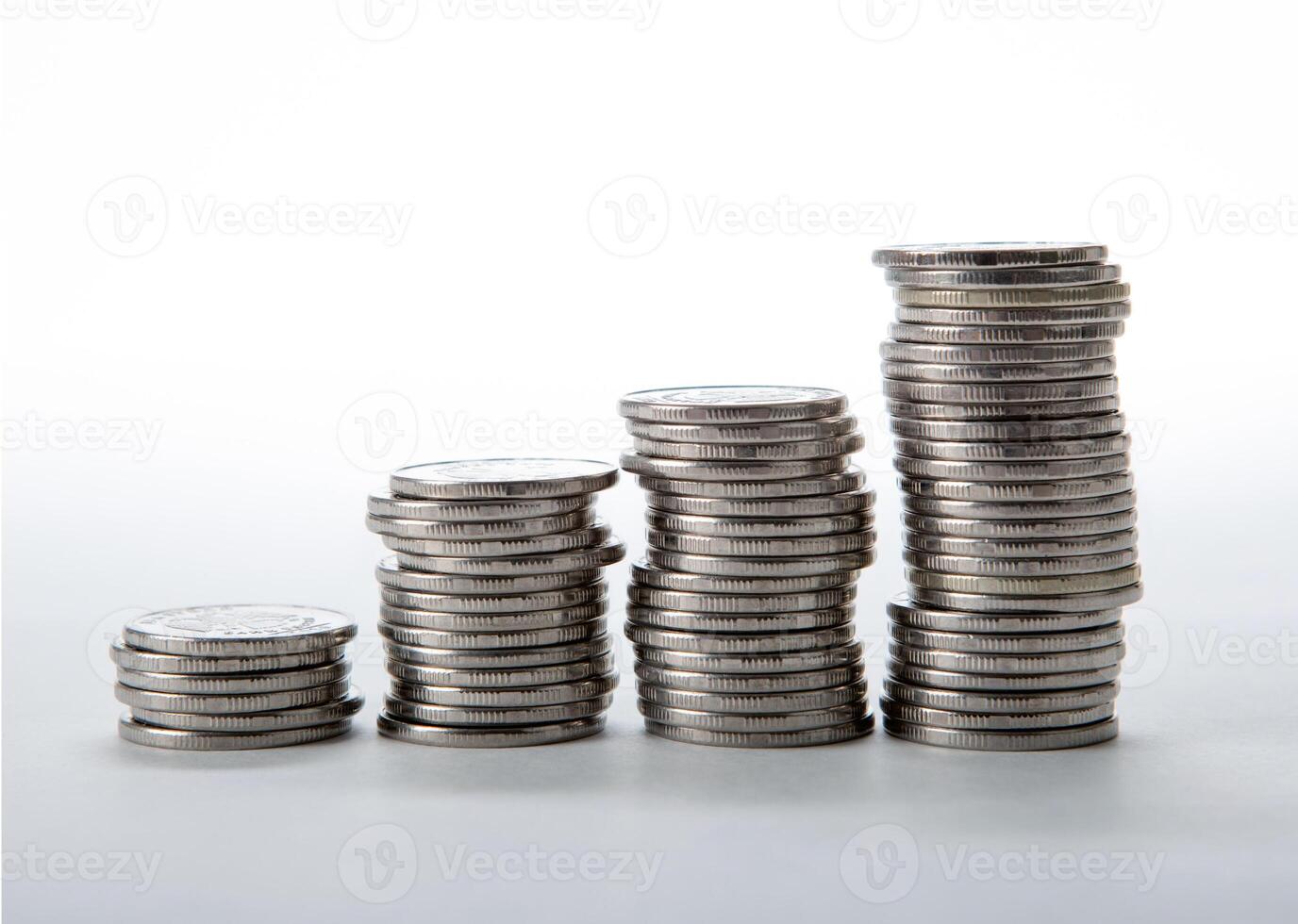 stacks of coins on a white background photo