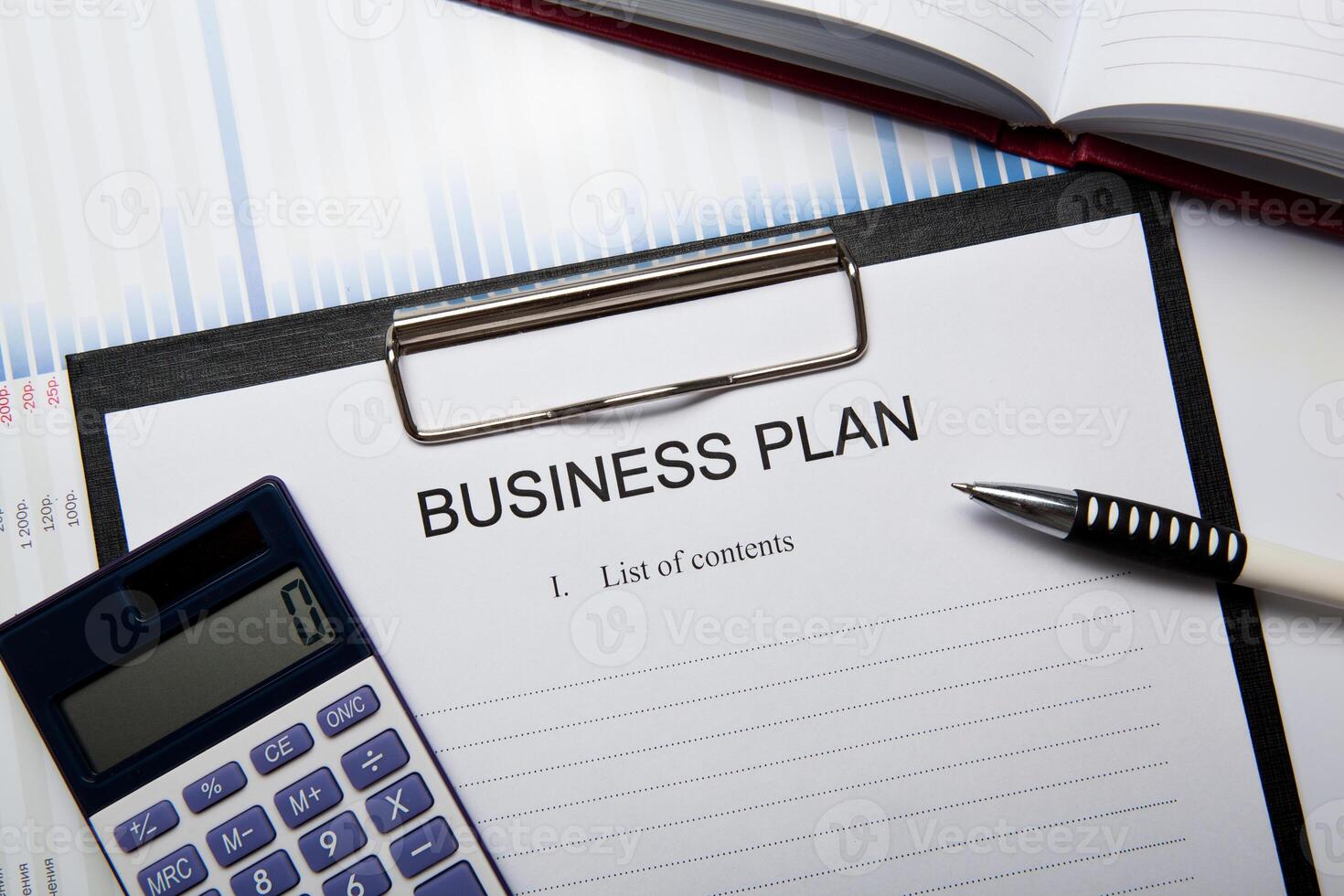 Business still life with business plan photo