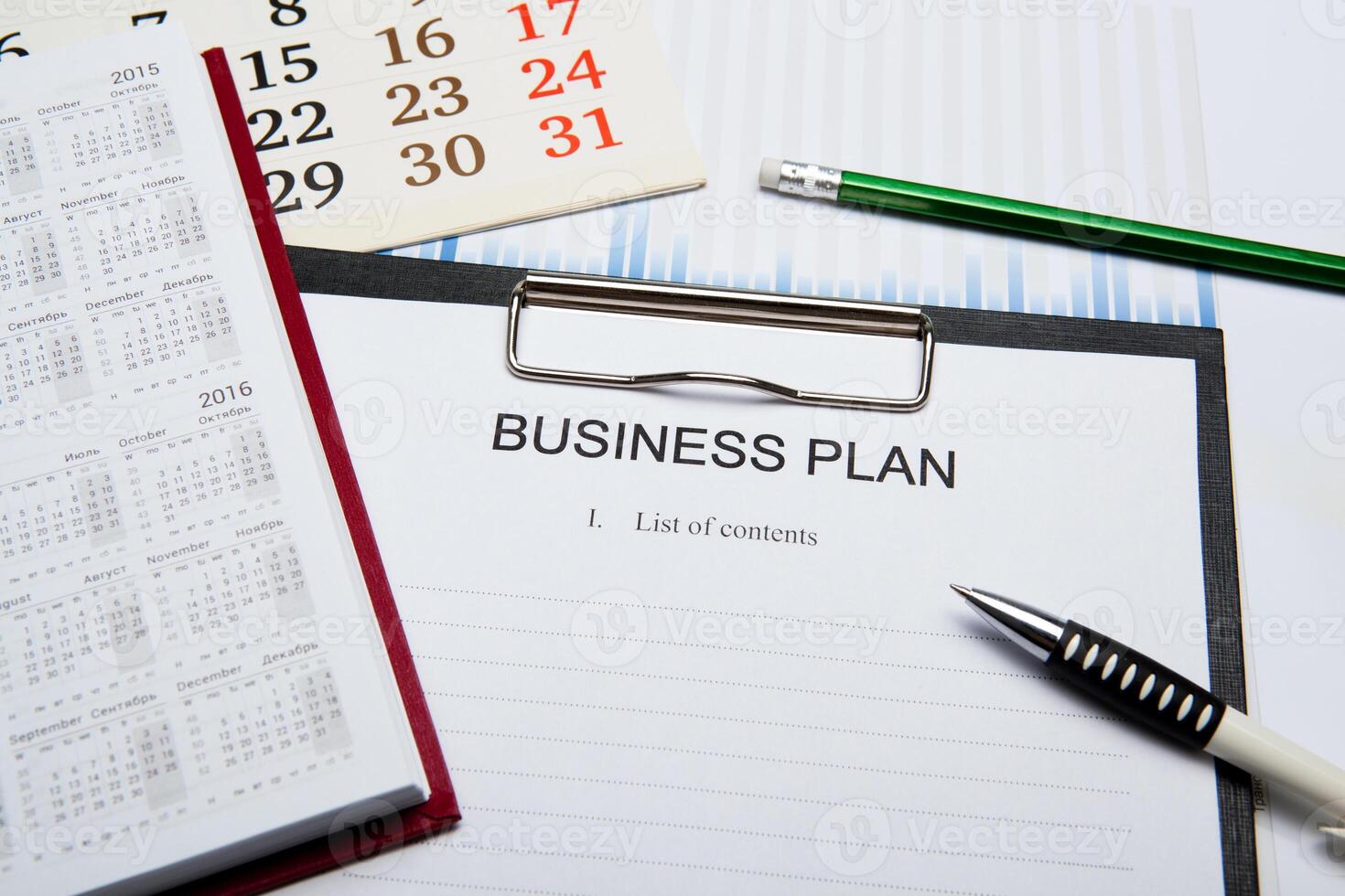 Business still life with business plan photo