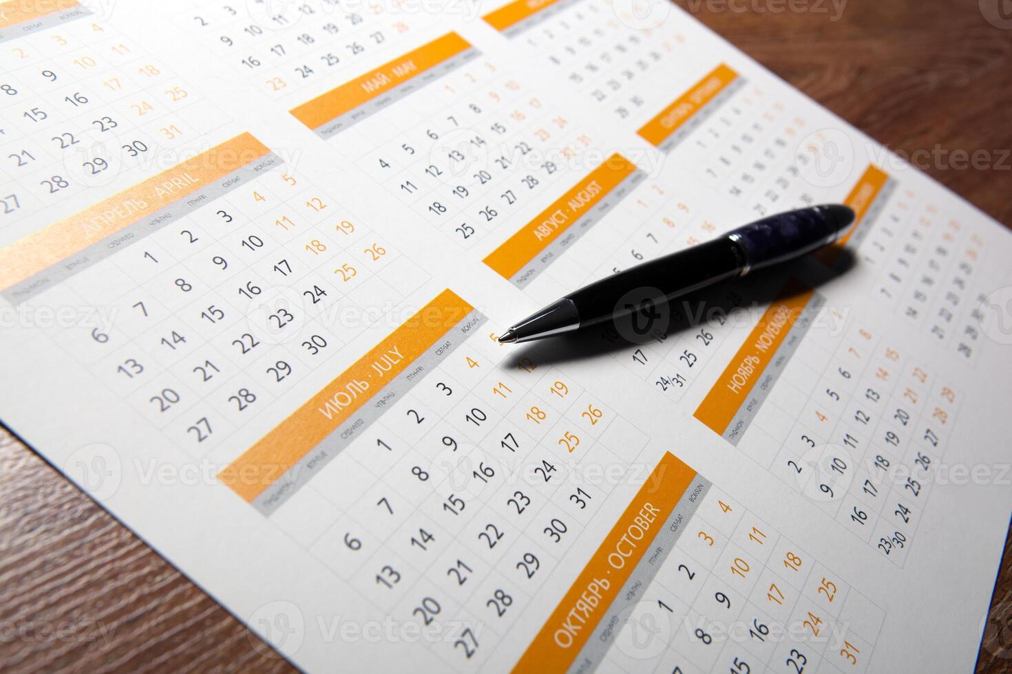 wall calendar with pen closeup photo