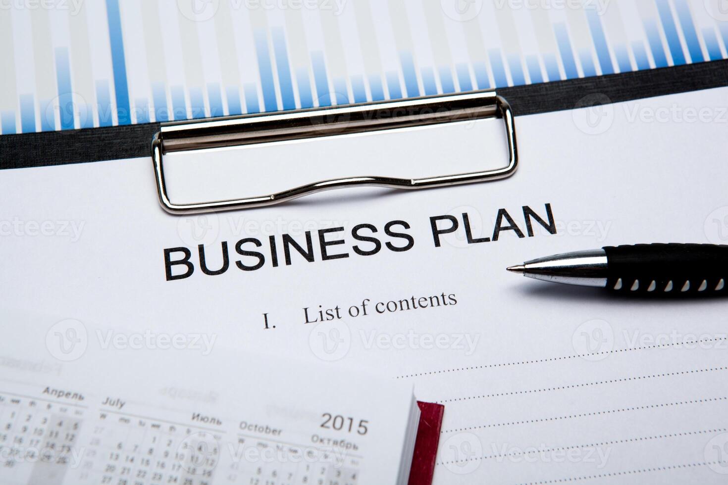 Business still life with business plan photo