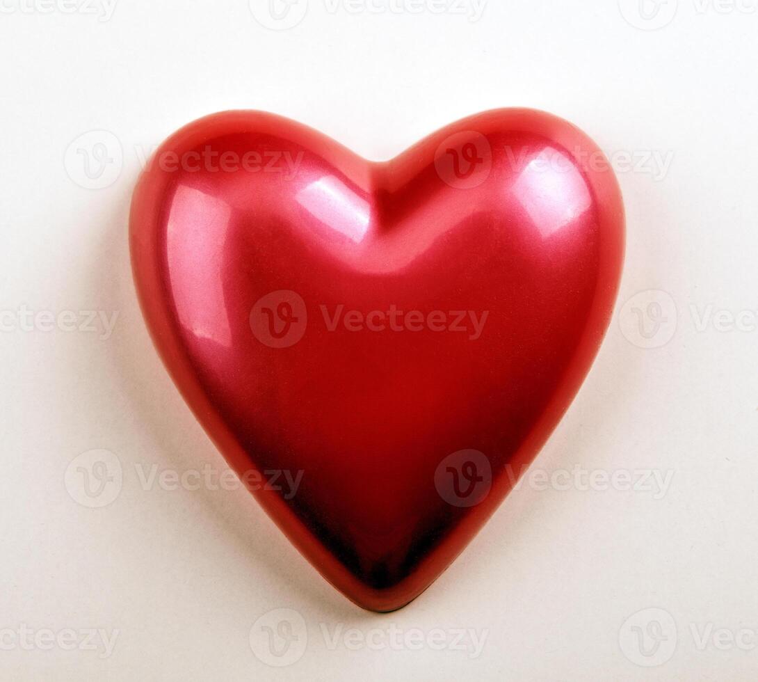 beauty red glossy heart on a white background photo