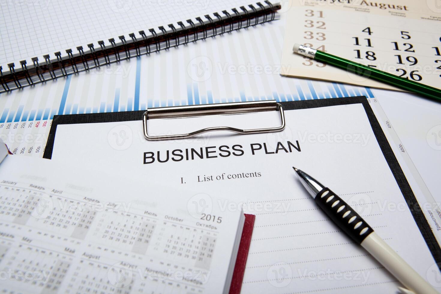Business still life with business plan photo