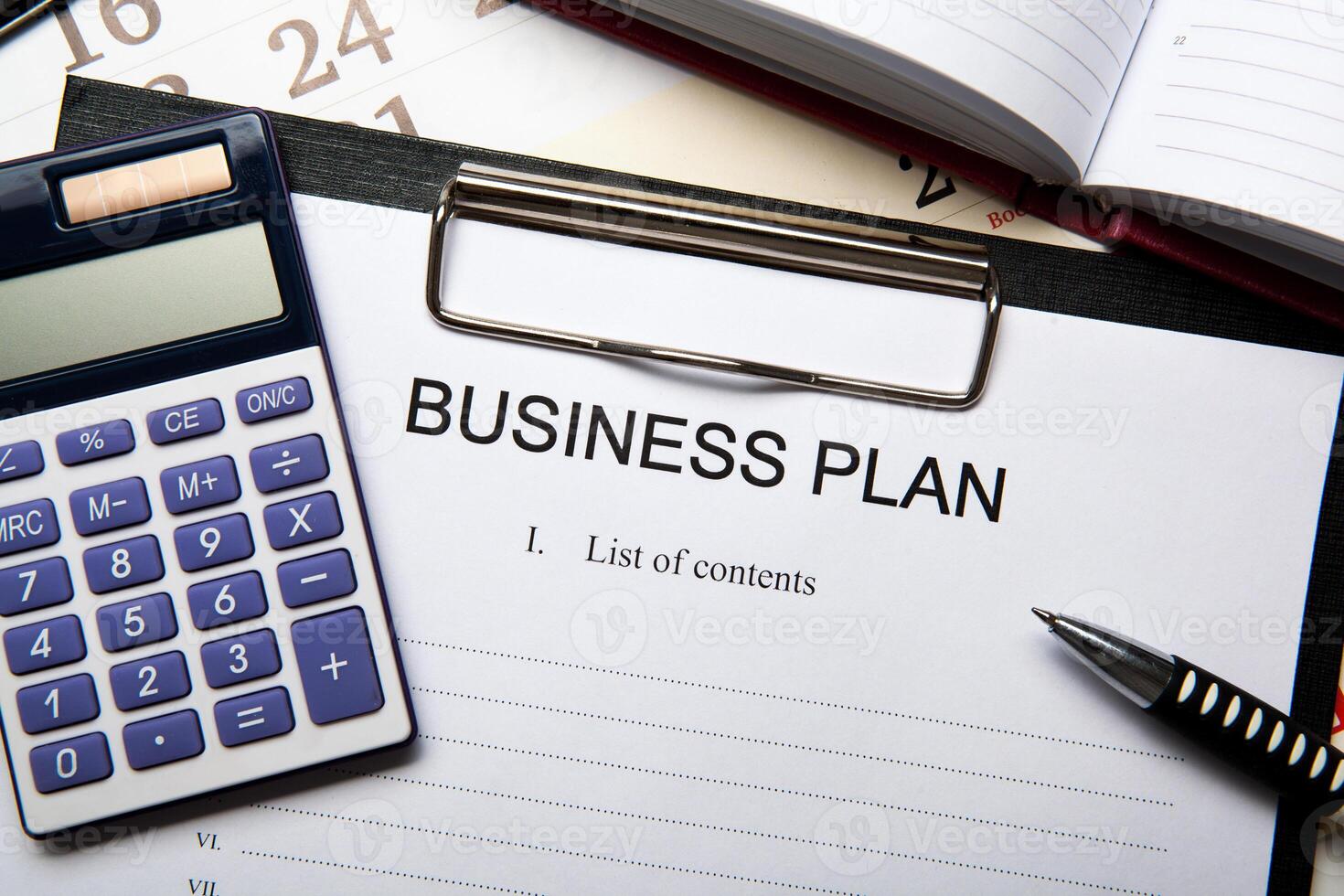 Business still life with business plan photo