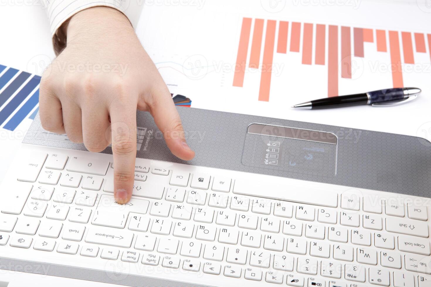 human hands on the notebook keyboard photo