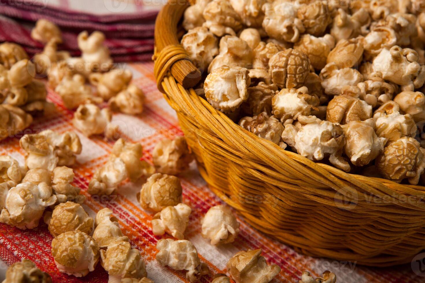 caramel popcorn in a basket on a napkin photo
