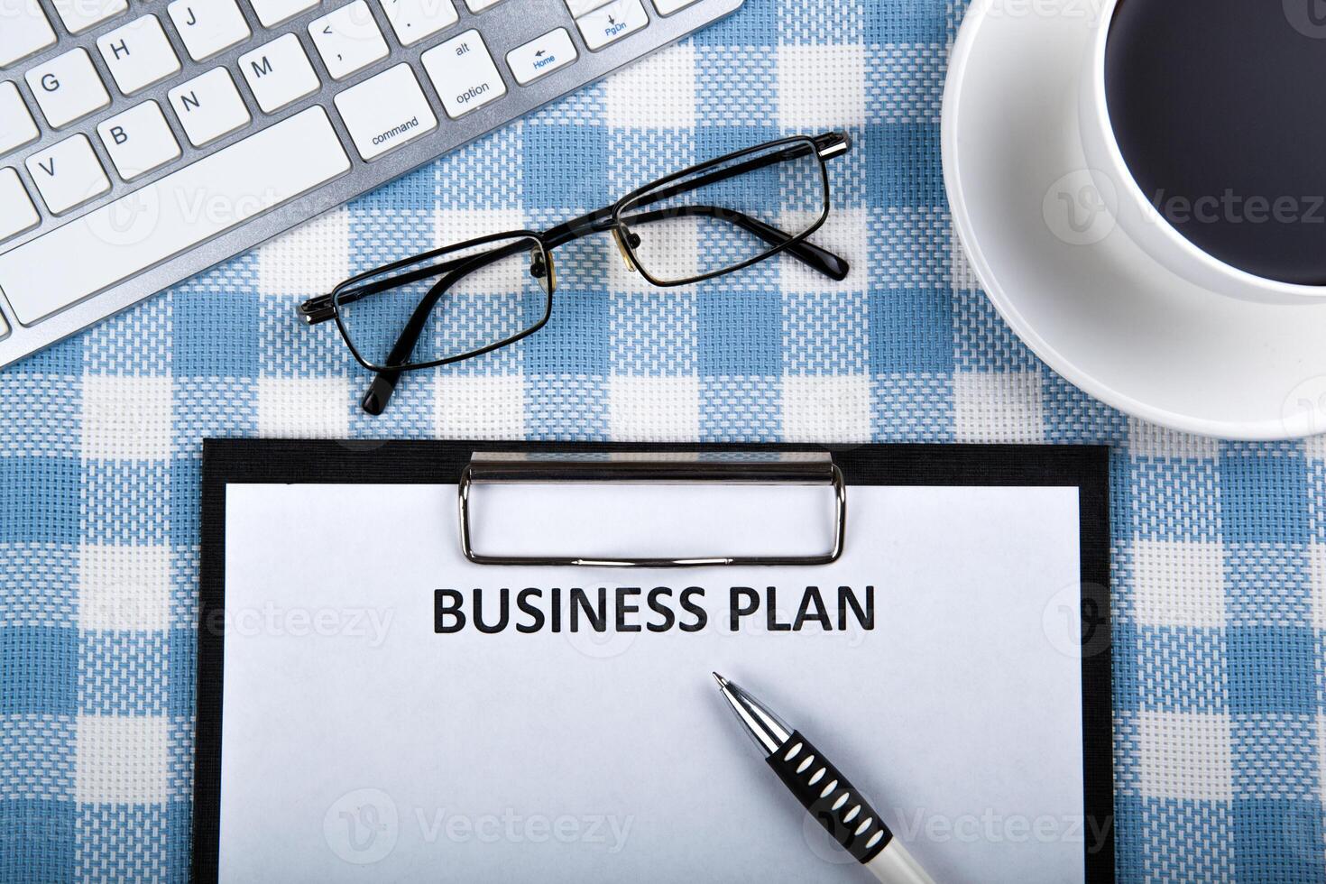 Business still life with business plan photo