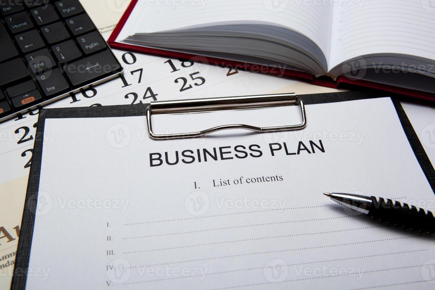 Business still life with business plan photo