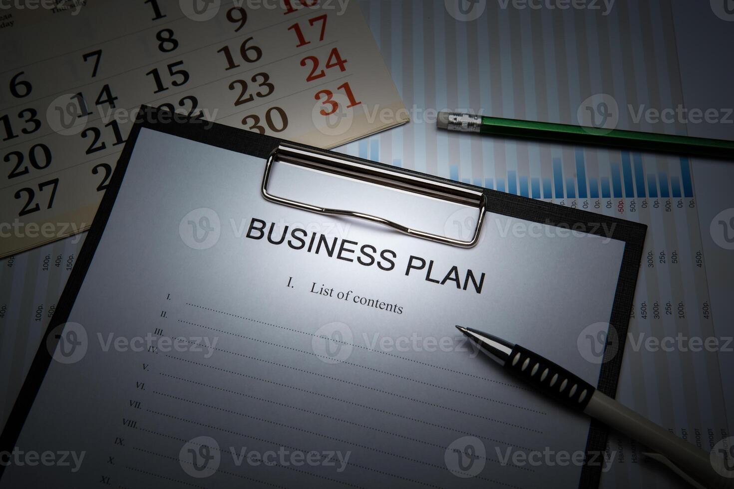 Business still life with business plan photo