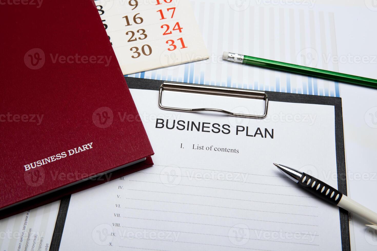 Business still life with business plan photo
