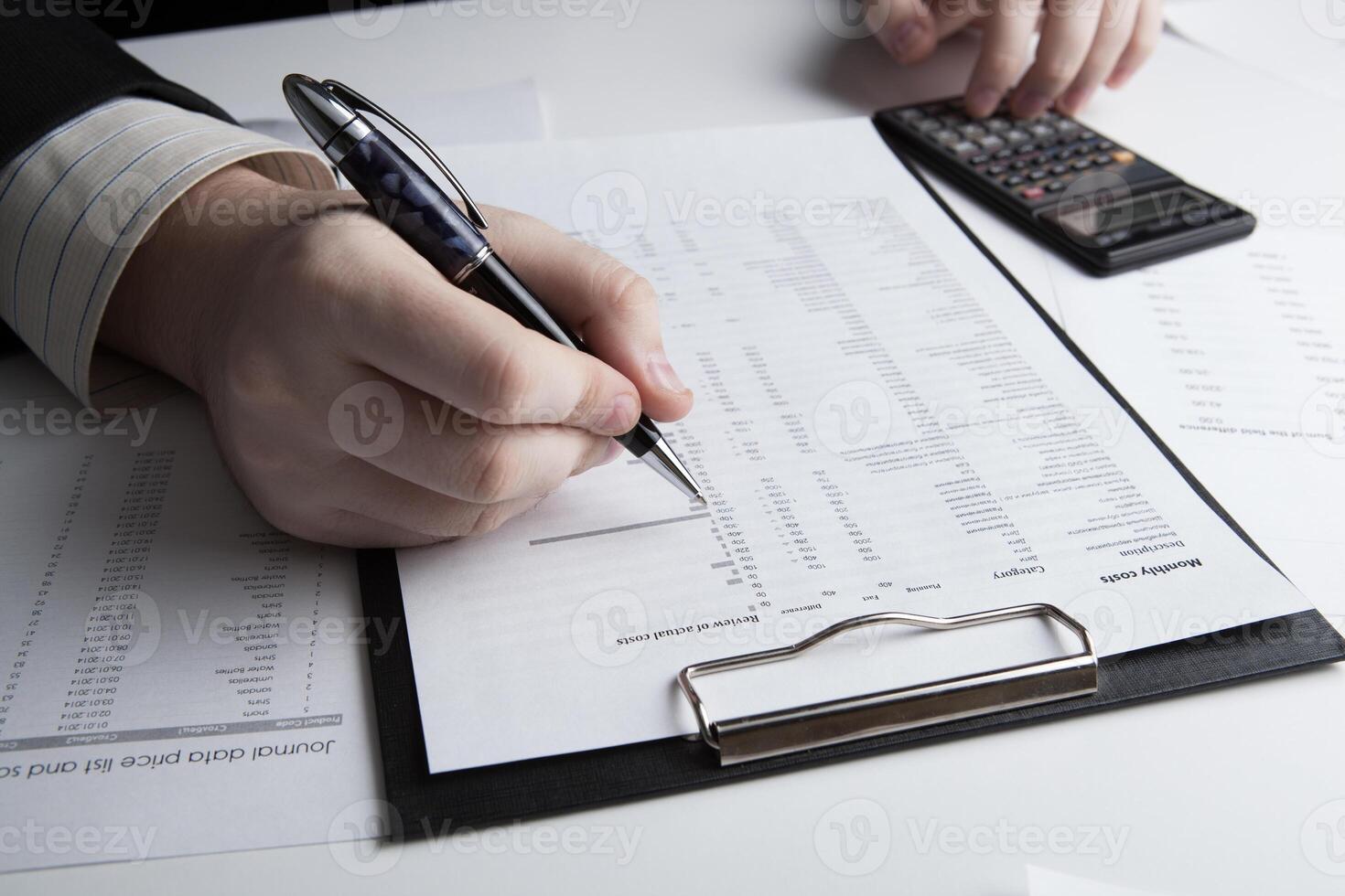 man is looking for information in the in the budget figures photo