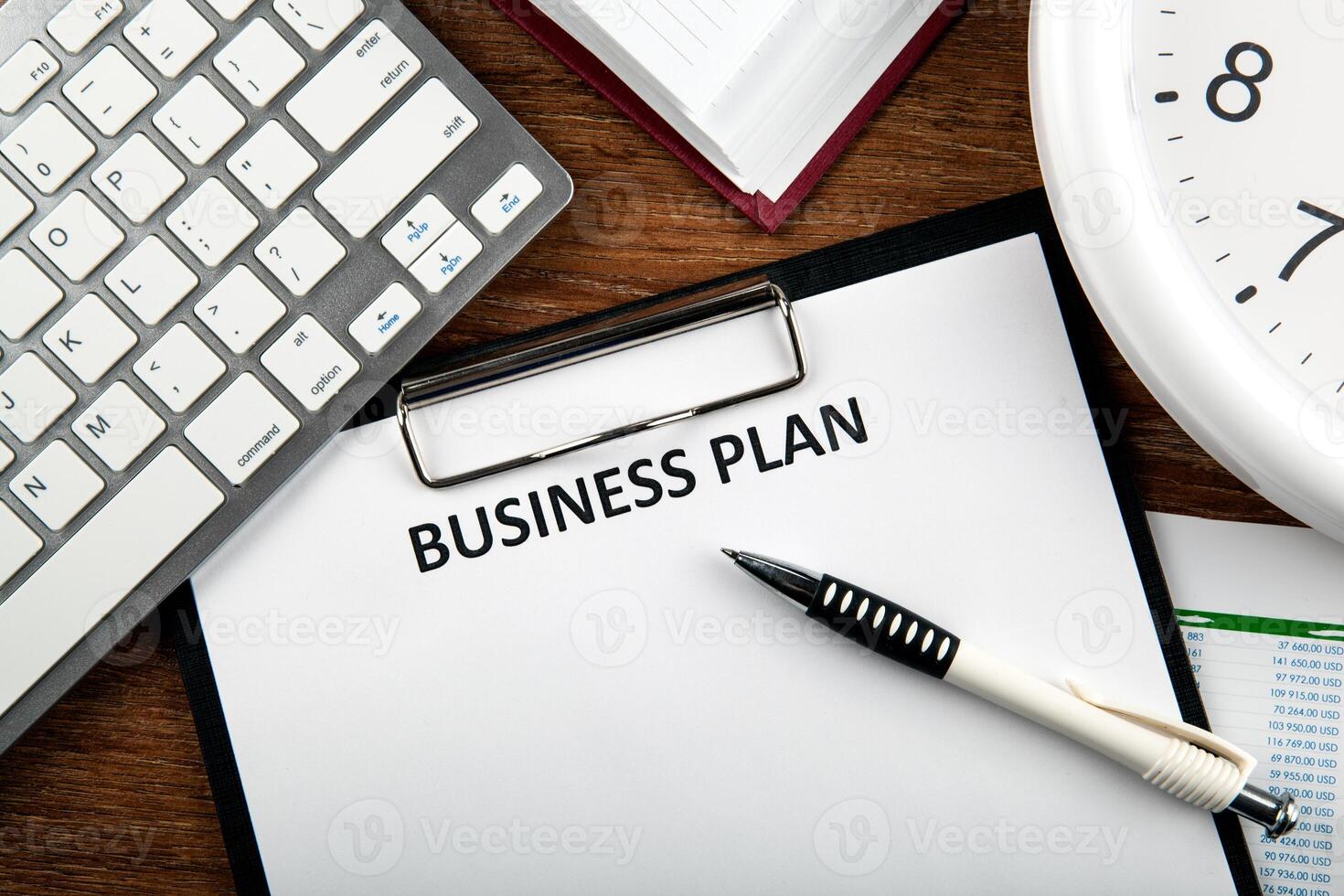 Business still life with business plan photo