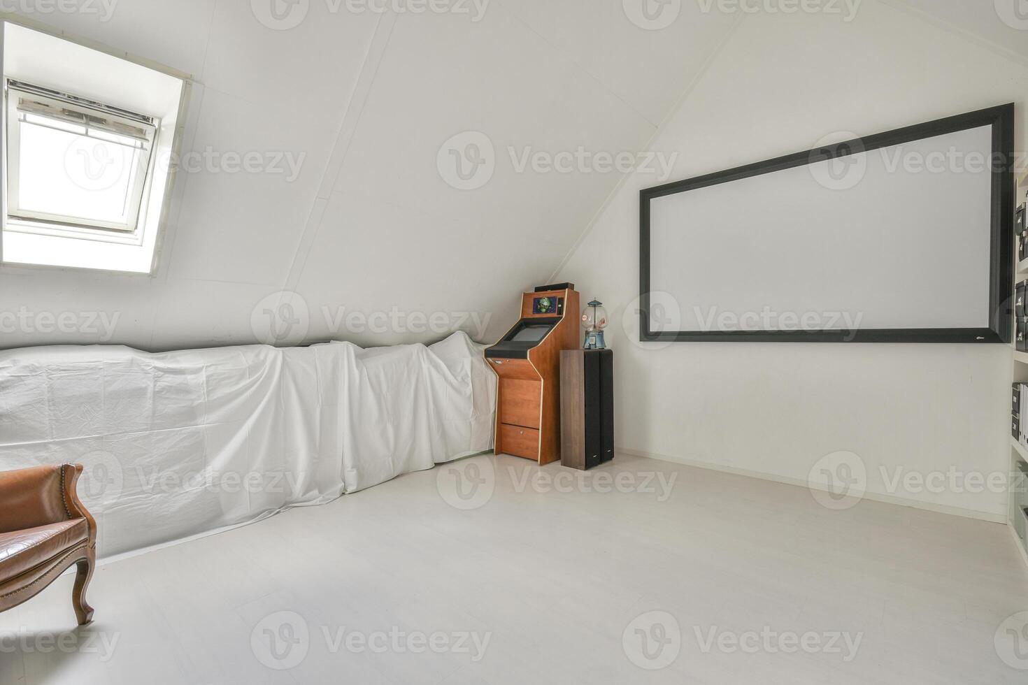 A room with a white ceiling and a large screen photo