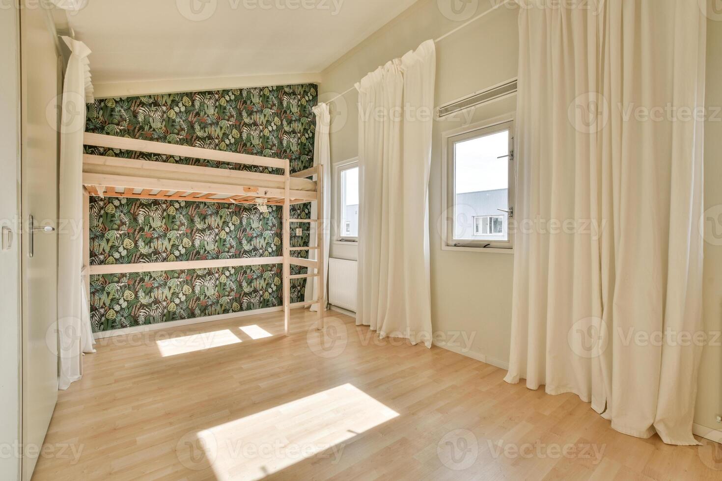 A room with a bunk bed and a wall with a green wallpaper photo
