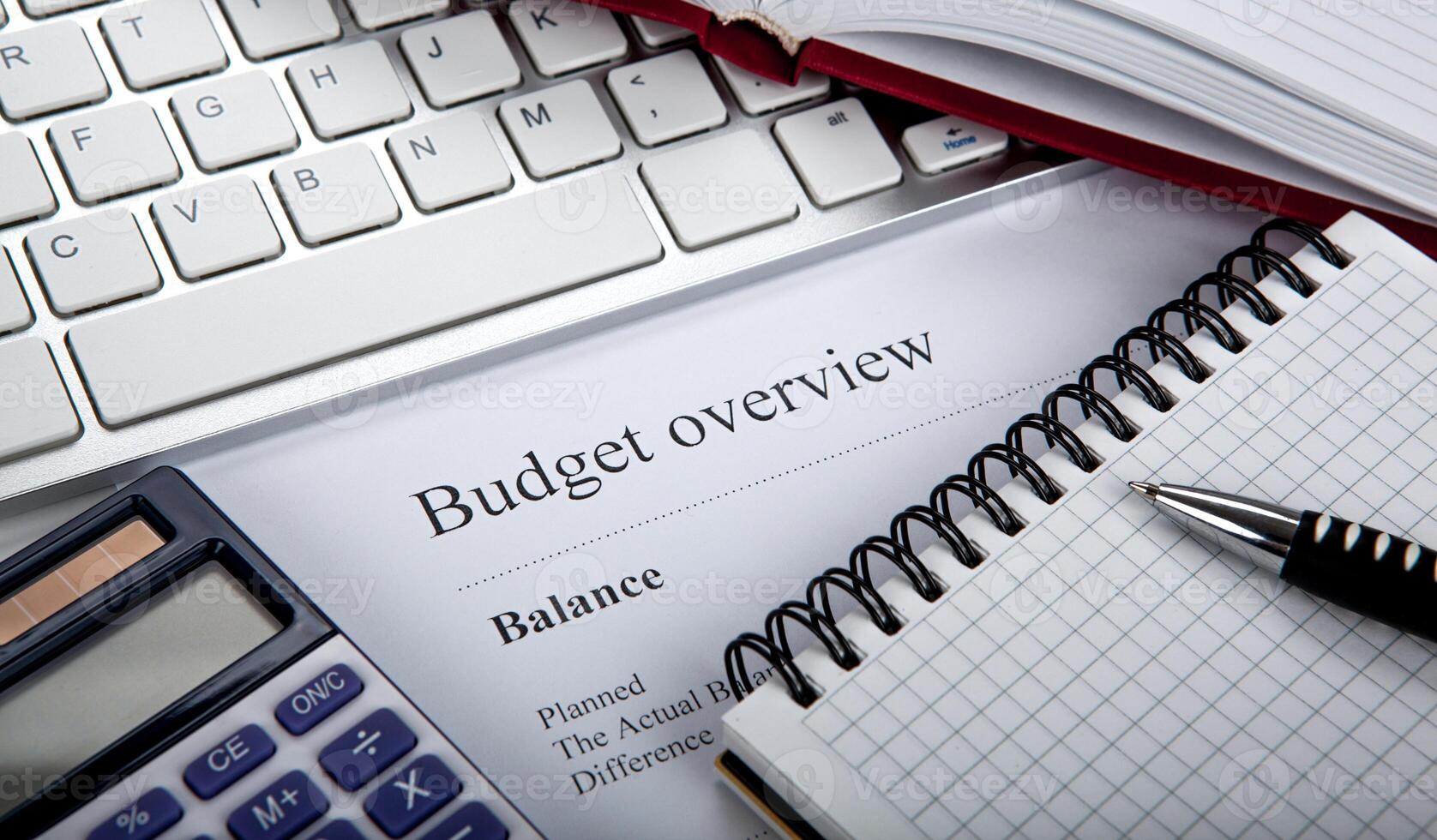 document with title budget overview on the desktop photo