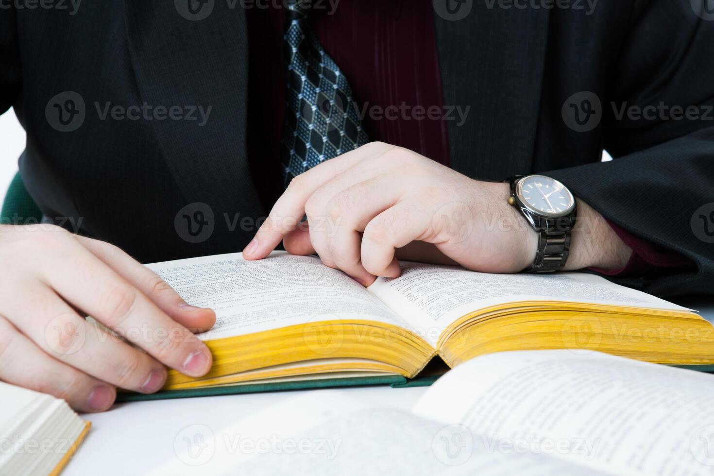 man reading a book photo