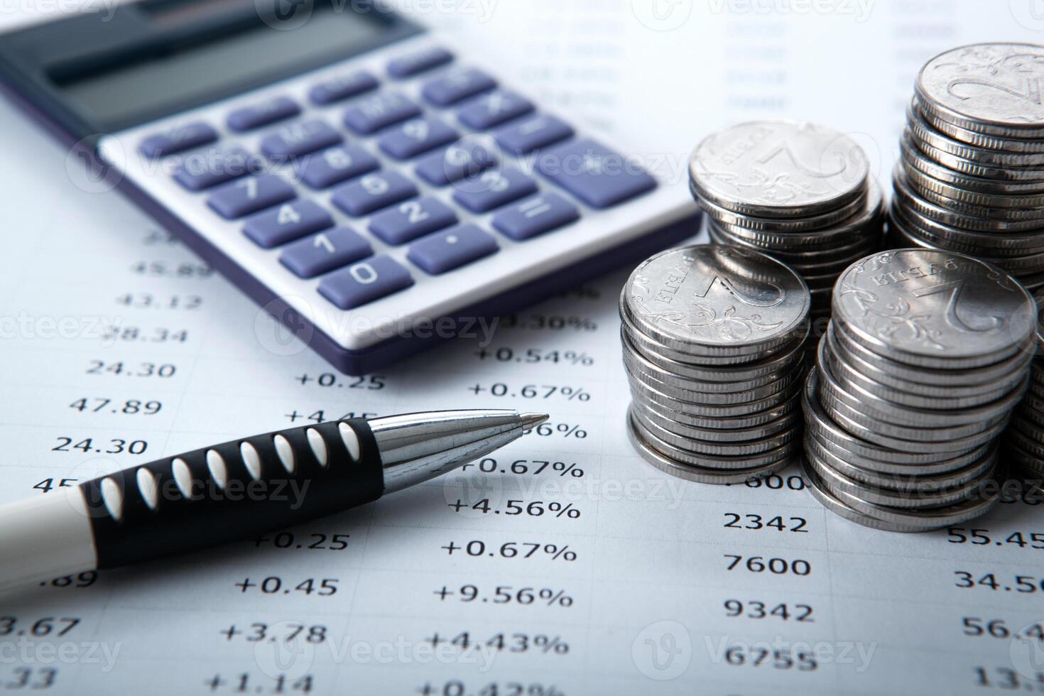 stacks of Russian rubles with calculator and pen photo