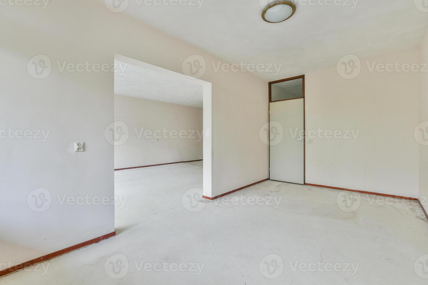 Empty room with white walls and a door photo