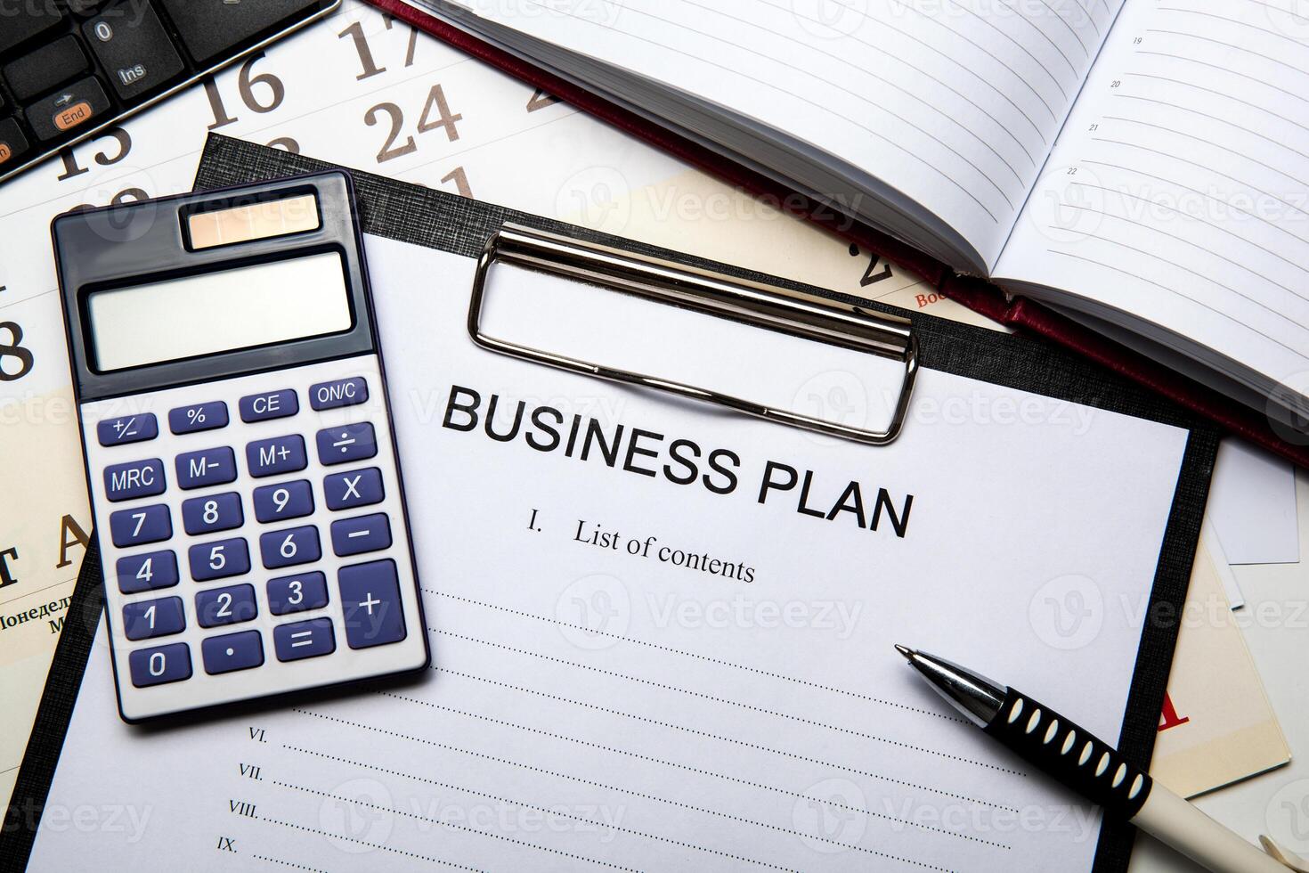 Business still life with business plan photo