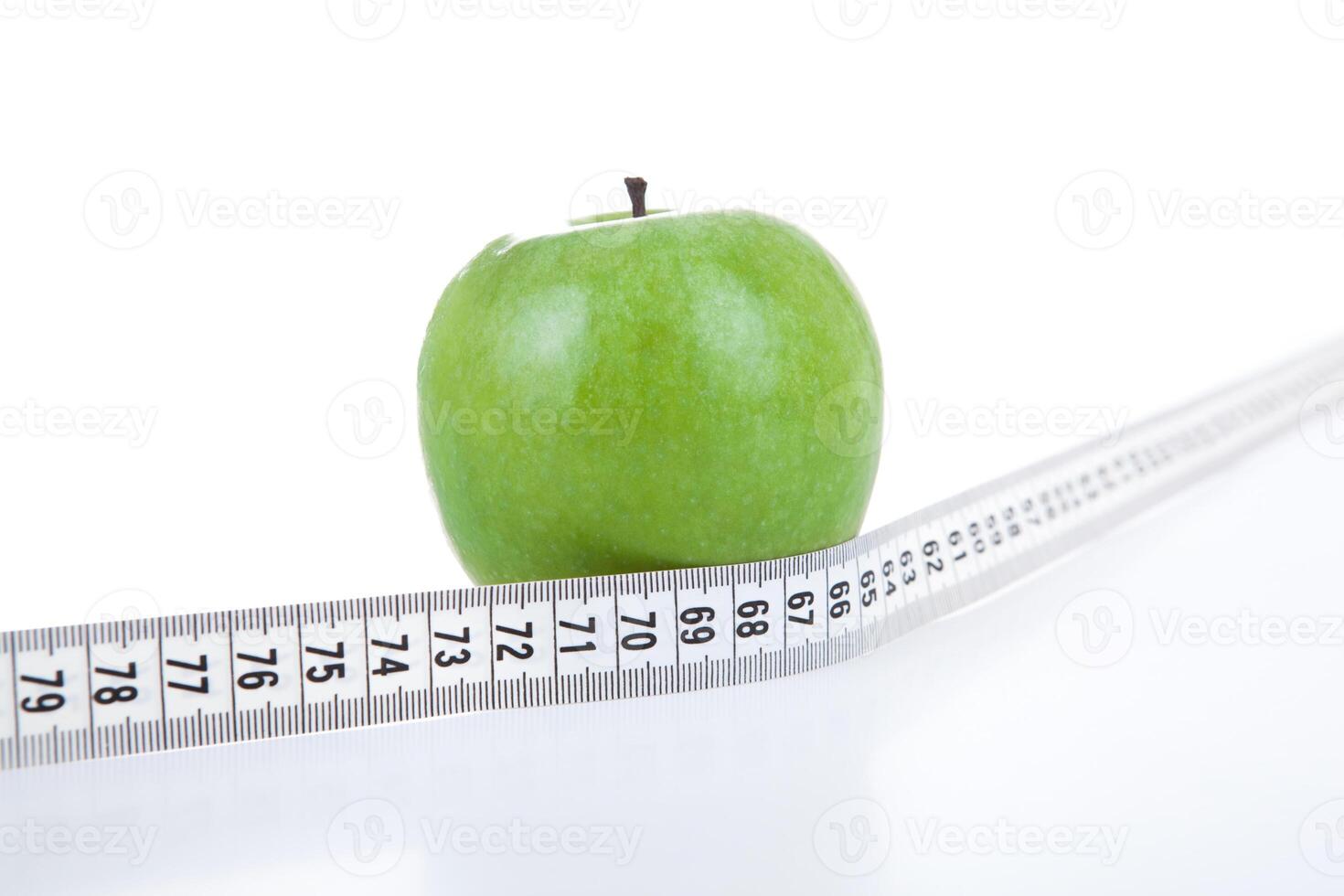 green apple with a ruler photo