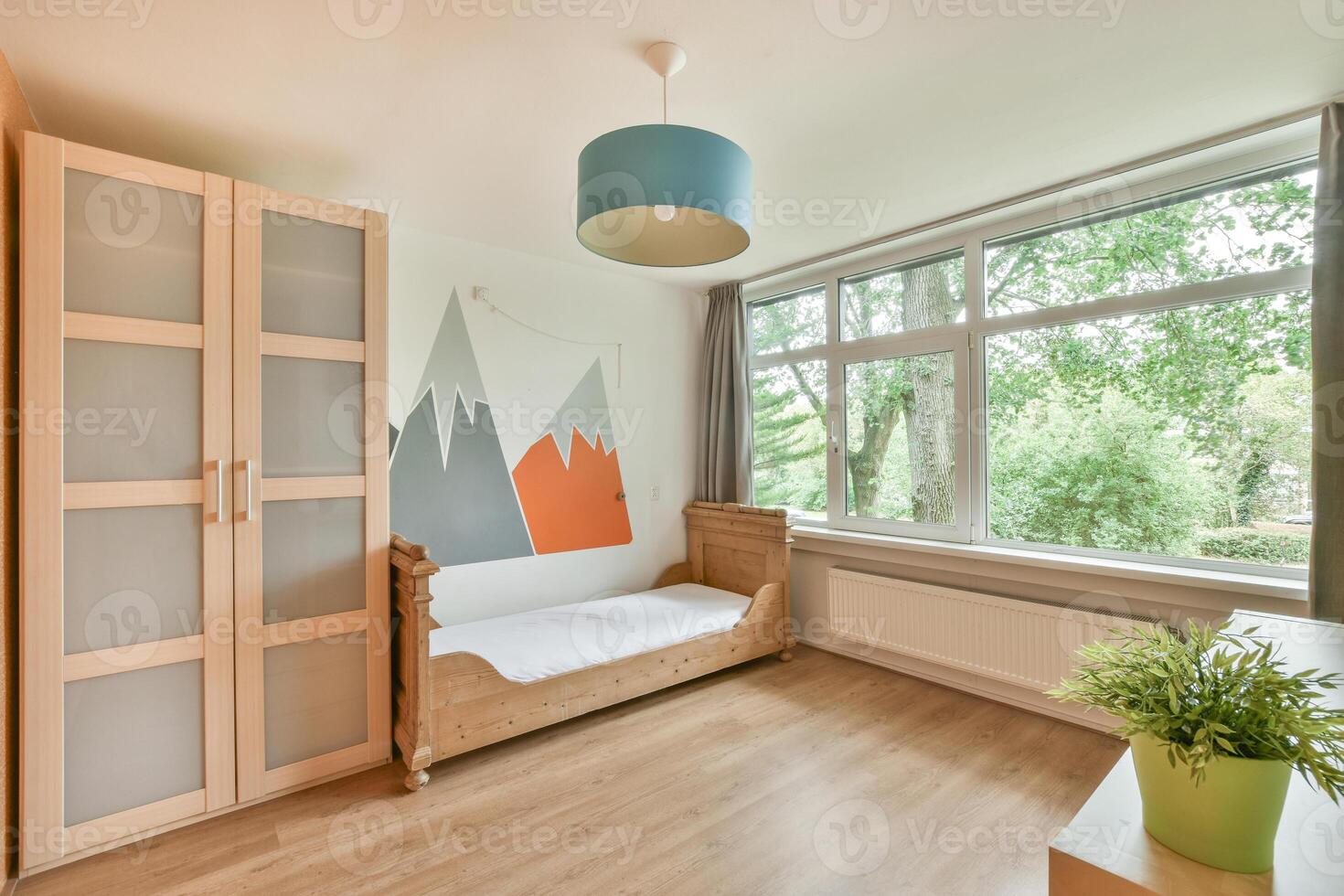 A bedroom with a bed, a dresser and a window photo