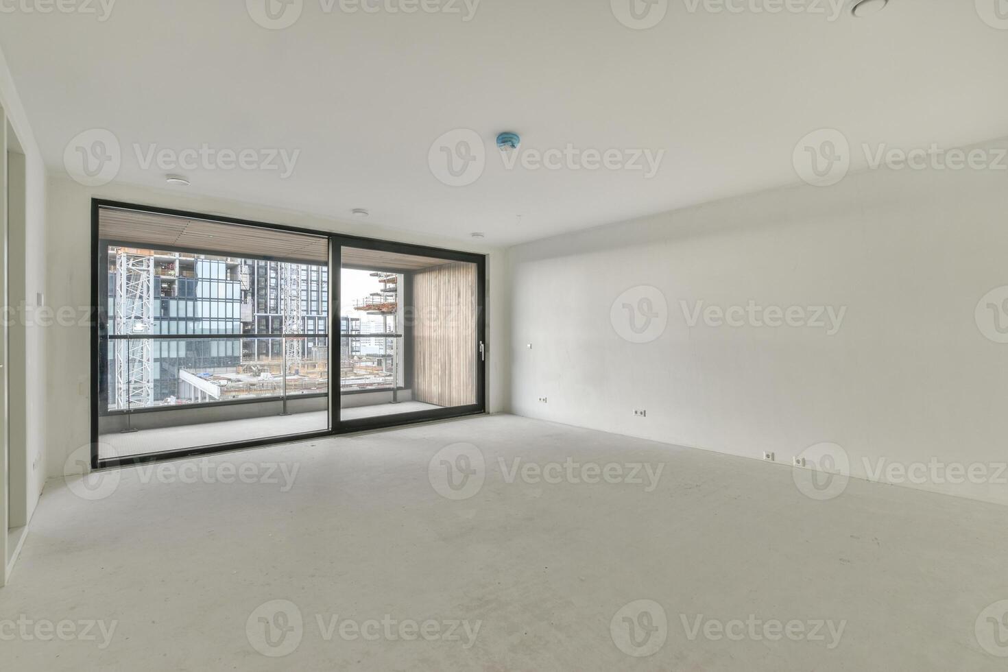An empty room with a sliding glass door photo