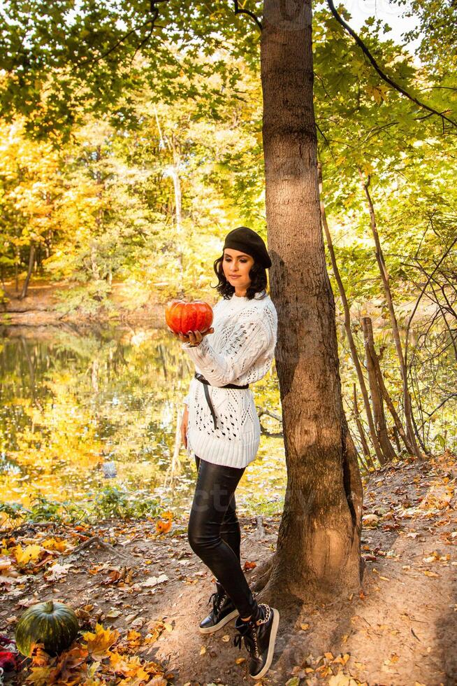 portrait of autumn girl with leaves photo