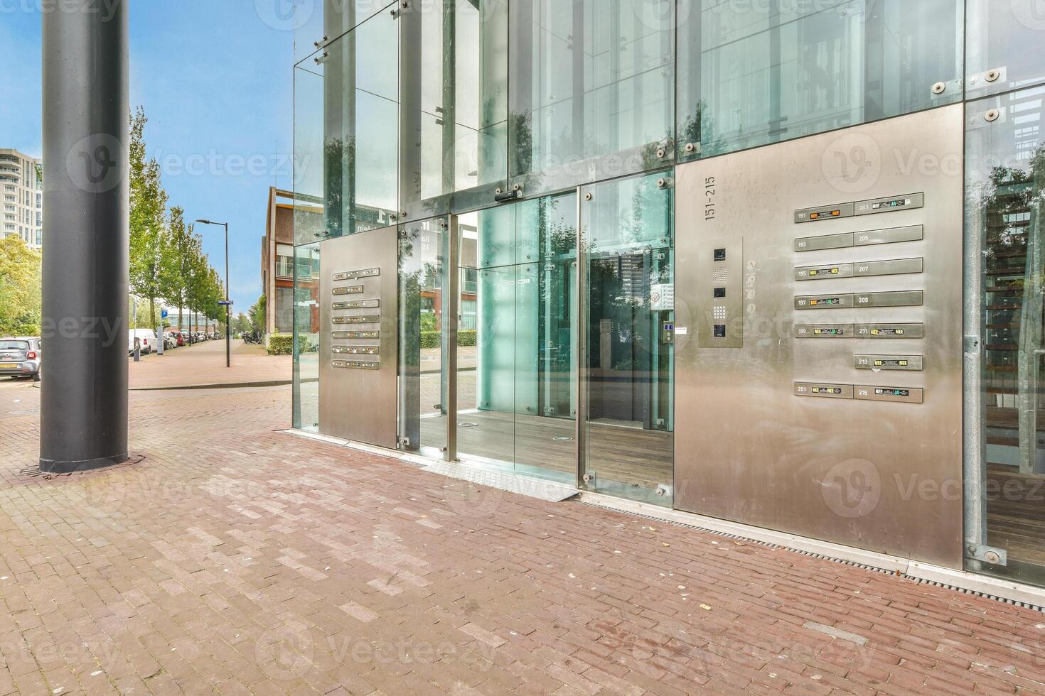 A large building with glass doors and a large sign photo