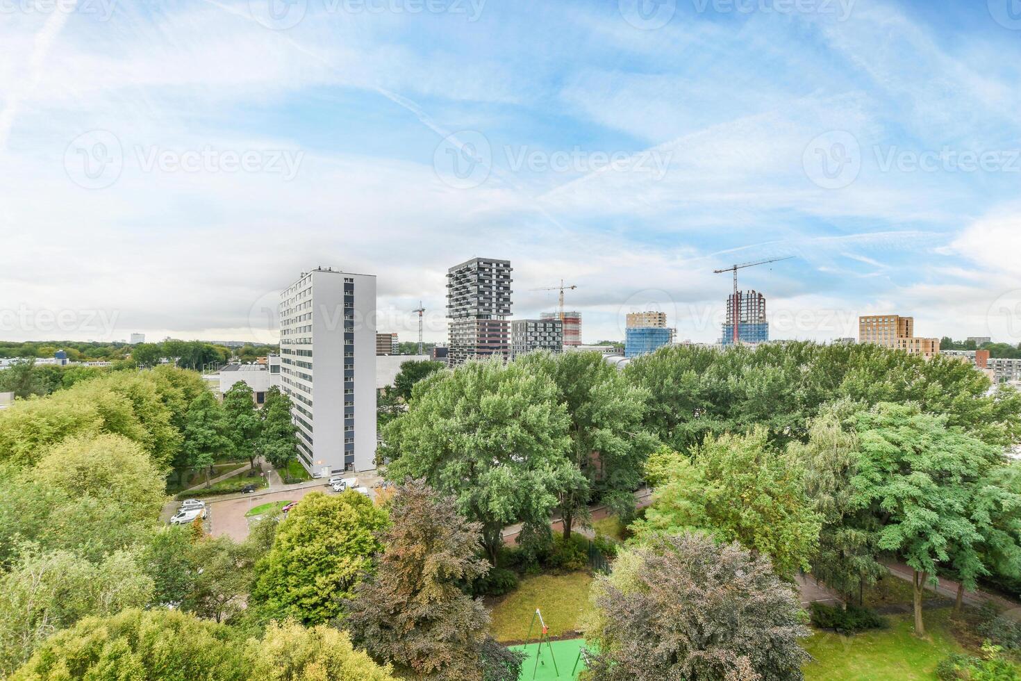A view of the city from above with trees and buildings photo