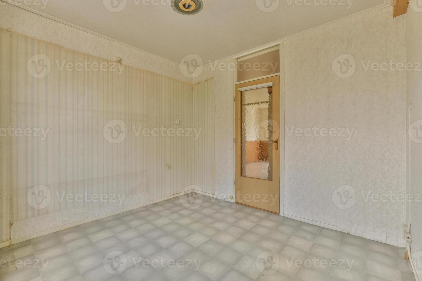 An empty room with a door and a window photo